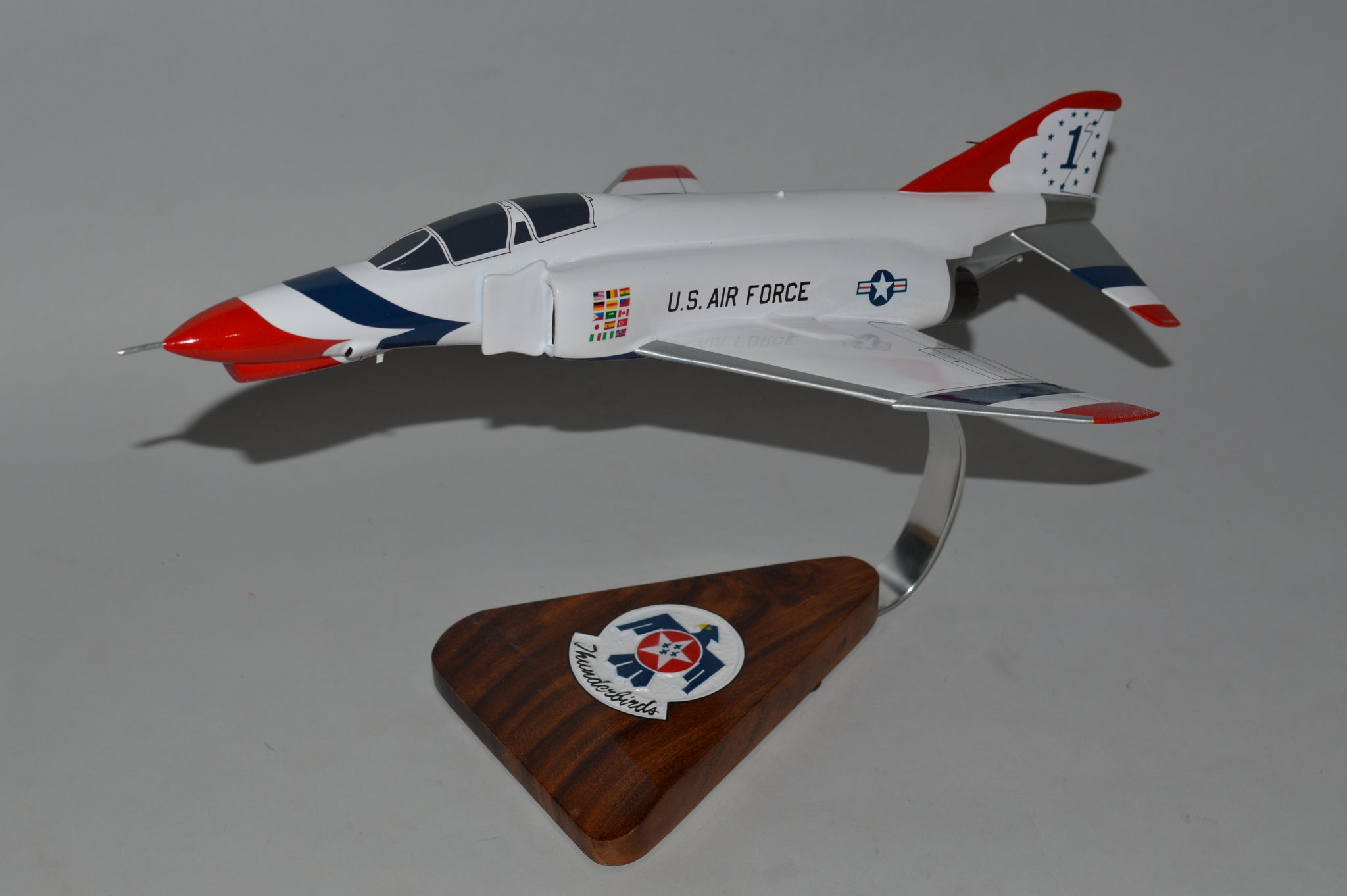 Model of a U.S. Air Force jet on a wooden stand